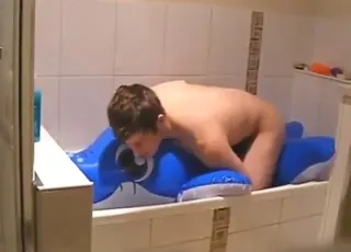 Zoophile gives blow-up dolphin a blowjob and fuck